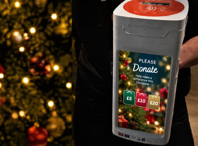Man holding CollecTin More with Christmas Campaign asking for donations