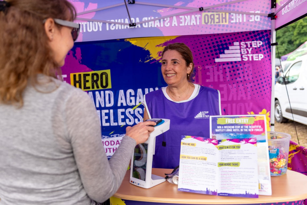 Lady making donation on a CollecTin More