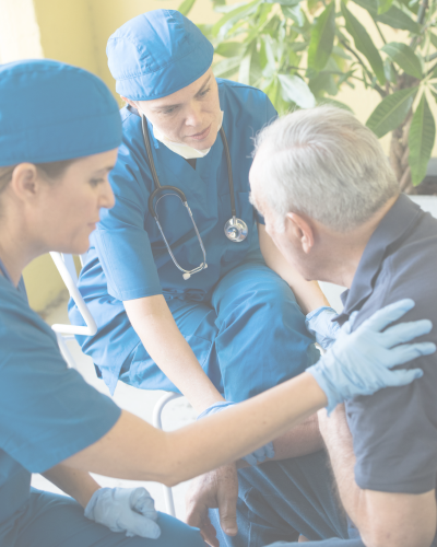 Two medical professionals attending to a patient.