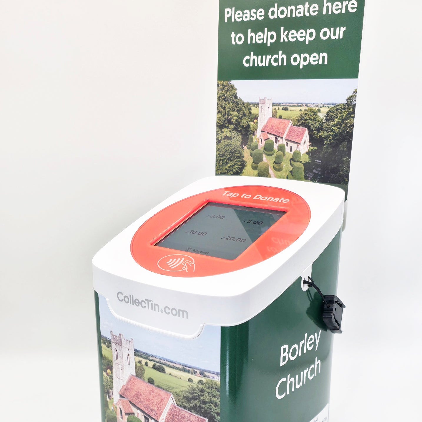 Donation box with a display screen and printed design of a church, featuring text to encourage donations.